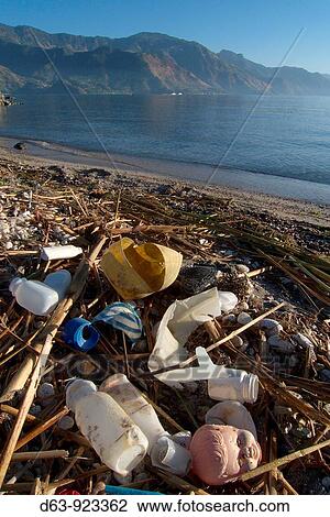 Guatemala. Lake Atitlan, seen from San Pedro. Garbage and plastic waste on the shoreline View Large Photo Image Stock Image - Guatemala. Lake Atitlan, seen from San Pedro. Garbage and plastic waste on the shoreline. Fotosearch