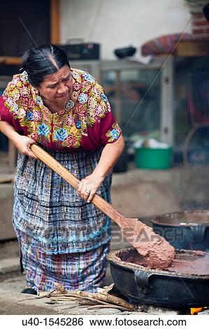 Stock Photograph - Guatemala, Mayan woman with pot of beans. Fotosearch