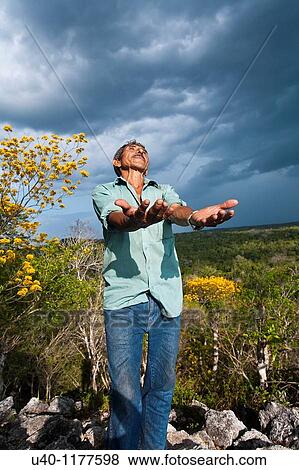 Stock Photo - Guatemala, Peten, El Mirador basin, man on top of Temple Los Monos. Fotosearch