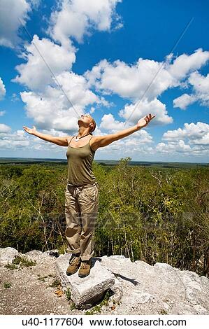 Guatemala, Peten, El Mirador, woman with outstretched arms View Large Photo Image Picture - Guatemala, Peten, El Mirador, woman with outstretched arms. Fotosearch
