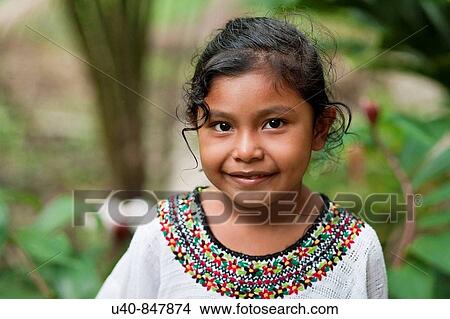 Picture - Guatemala, Rio Dulce, 7 year old girl posing. Fotosearch