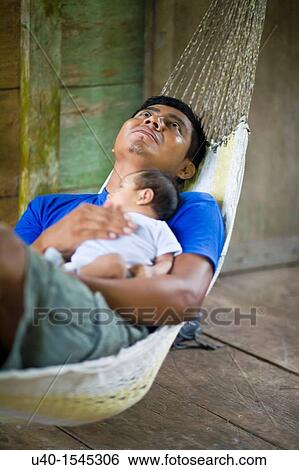 Guatemala, Rio Dulce, Father with newborn View Large Photo Image Stock Photograph - Guatemala, Rio Dulce, Father with newborn. Fotosearch