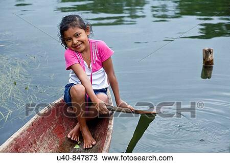 Guatemala, Rio Dulce, girl in canoe View Large Photo Image Stock Image - Guatemala, Rio Dulce, girl in canoe. Fotosearch