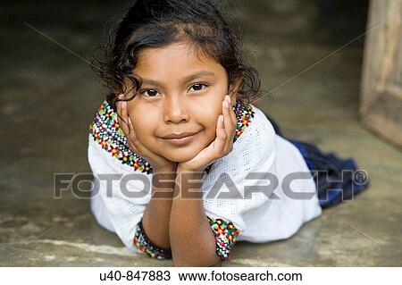 Stock Image - Guatemala, Rio Dulce, girl laying down. Fotosearch