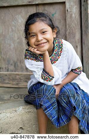 Stock Photo - Guatemala, Rio Dulce, girl on porch. Fotosearch