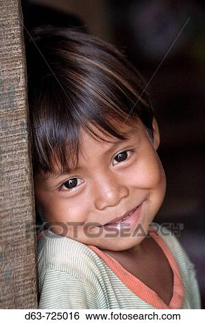 GUATEMALA Santa Rita village of returnees, in the Peten The community fled Guatemala during the violence of the 1980s and now in times of peace have returned to settle in the jungle lowlands Child from the village View Large Photo Image Stock Photograph - GUATEMALA Santa Rita village of returnees, in the Peten The community fled Guatemala during the violence of the 1980s and now in times of peace have returned to settle in the jungle lowlands Child from the village. Fotosearch