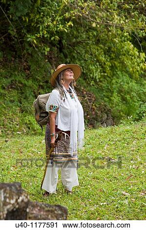 Stock Image - Guatemala, Tikal, Shaman looking up. Fotosearch