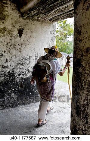 Stock Photo - Guatemala, Tikal, Shaman walking through temple. Fotosearch