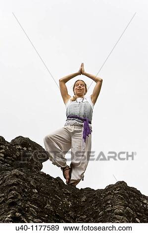 Stock Photo - Guatemala, Tikal, woman doing Yoga. Fotosearch