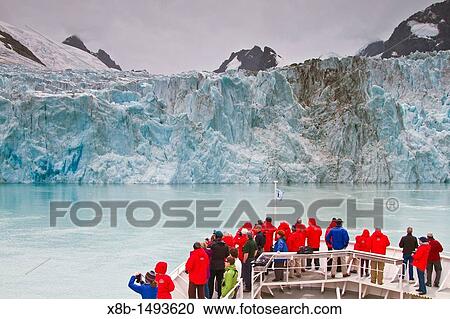 Stock Image - Guests from the Lindblad Expedition ship National Geographic Explorer photographing Drygalski Fjord on South Georgia Island, Southern Ocean. Fotosearch