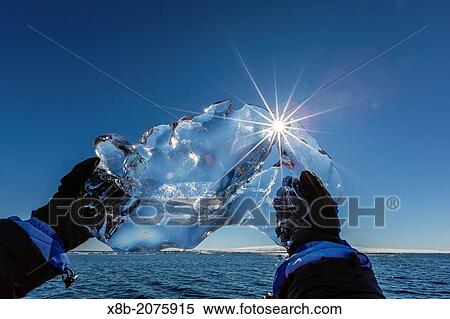 Stock Photography - Guests from the Lindblad Expedition ship National Geographic Explorer in Storfjord, Spitsbergen in the Svalbard Archipelago, Norway.. Fotosearch