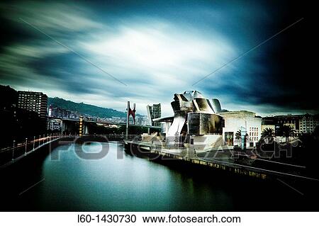 Stock Image - Guggenheim Bilbao Museum by Architect Frank Gehry, Nervion River, Bilbao, Province of Biscay, Basque Country, Spain. Fotosearch