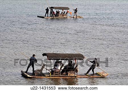 Stock Image - Guilin (China): boats for tourists along the Li River. Fotosearch