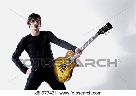 Stock Image - Guitarist posing. Fotosearch