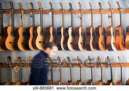 Guitars in a music store. Seville, Andalusia, Spain View Large Photo Image Stock Image - Guitars in a music store. Seville, Andalusia, Spain. Fotosearch
