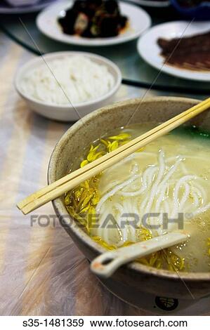 ? Guoqiao mi xian? (Crossing the bridge noodles) a kind of rice noodle soup from Yunnan, Kunming, China View Large Photo Image Stock Photo - ? Guoqiao mi xian? (Crossing the bridge noodles) a kind of rice noodle soup from Yunnan, Kunming, China. Fotosearch