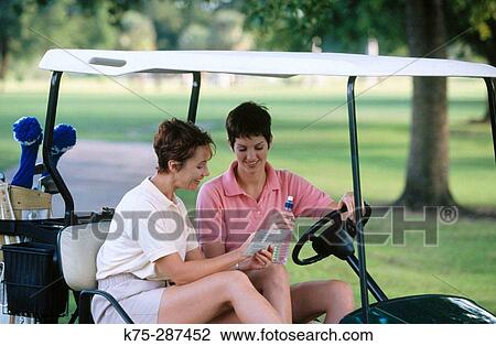 gwo women checking their scorecard on golf course View Large Photo Image Stock Image - gwo women checking their scorecard on golf course. Fotosearch