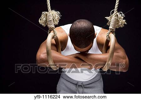 Picture - Gymnast man on Rings.. Fotosearch