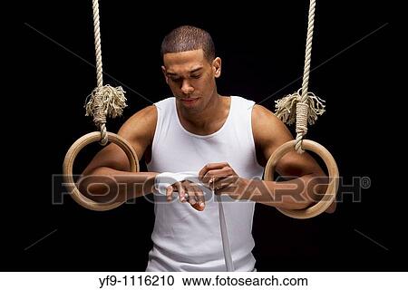 Gymnast man on Rings. View Large Photo Image Stock Image - Gymnast man on Rings.. Fotosearch