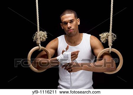 Gymnast man on Rings. View Large Photo Image Stock Image - Gymnast man on Rings.. Fotosearch