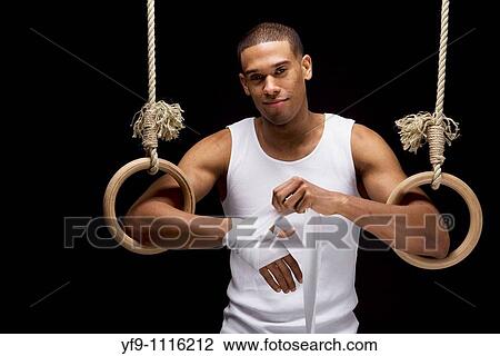 Gymnast man on Rings. View Large Photo Image Stock Image - Gymnast man on Rings.. Fotosearch