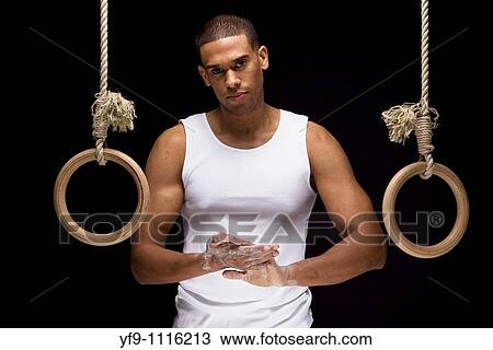 Gymnast man on Rings. View Large Photo Image Stock Image - Gymnast man on Rings.. Fotosearch