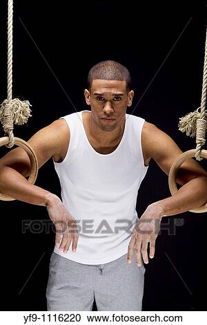 Gymnast man on Rings. View Large Photo Image Stock Image - Gymnast man on Rings.. Fotosearch