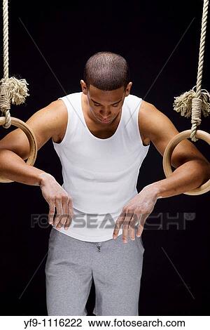 Gymnast man on Rings. View Large Photo Image Stock Image - Gymnast man on Rings.. Fotosearch