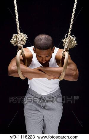 Gymnast man on Rings. View Large Photo Image Stock Image - Gymnast man on Rings.. Fotosearch