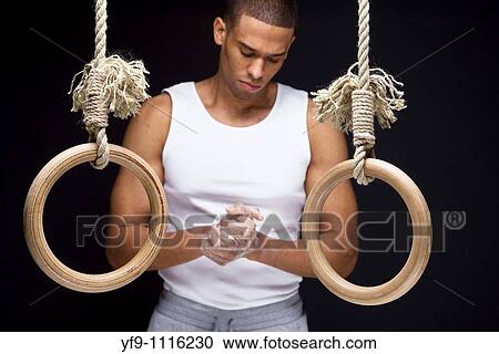 Gymnast man on Rings. View Large Photo Image Stock Image - Gymnast man on Rings.. Fotosearch