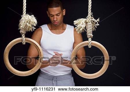 Gymnast man on rings View Large Photo Image Stock Image - Gymnast man on rings. Fotosearch