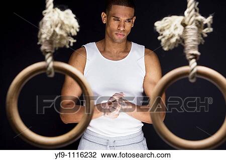 Gymnast man on Rings. View Large Photo Image Stock Image - Gymnast man on Rings.. Fotosearch