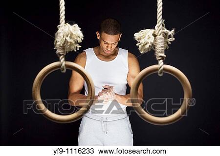 Gymnast man on Rings. View Large Photo Image Stock Image - Gymnast man on Rings.. Fotosearch
