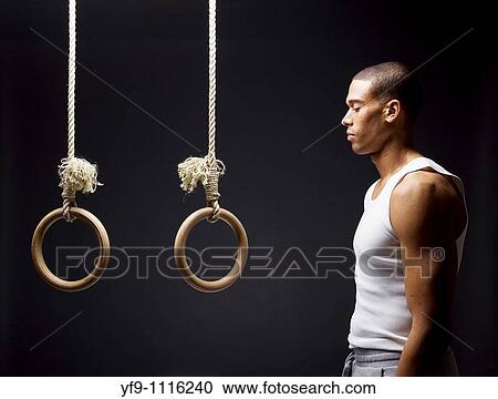 Gymnast man on Rings. View Large Photo Image Stock Image - Gymnast man on Rings.. Fotosearch