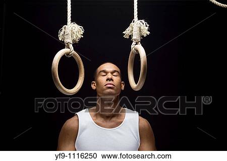 Stock Image - Gymnast man on Rings.. Fotosearch