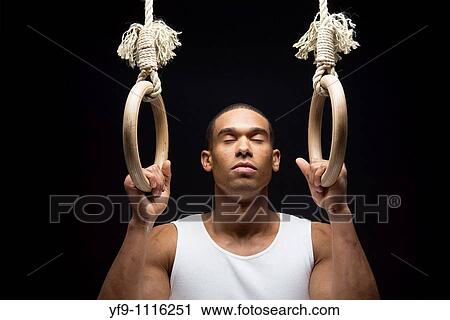 Gymnast man on Rings. View Large Photo Image Stock Image - Gymnast man on Rings.. Fotosearch