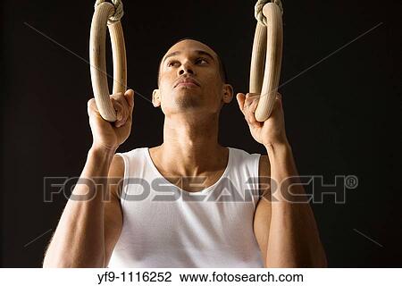 Gymnast man on Rings. View Large Photo Image Stock Image - Gymnast man on Rings.. Fotosearch