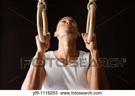 Gymnast man on Rings. View Large Photo Image Stock Image - Gymnast man on Rings.. Fotosearch