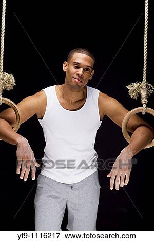 Gymnast man on Rings. View Large Photo Image Stock Photo - Gymnast man on Rings.. Fotosearch