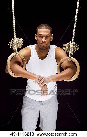 Gymnast man on Rings. View Large Photo Image Stock Photo - Gymnast man on Rings.. Fotosearch