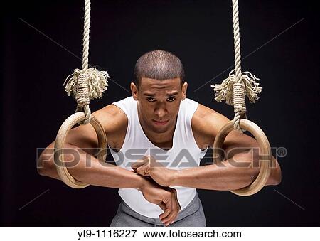 Gymnast man on Rings. View Large Photo Image Stock Photo - Gymnast man on Rings.. Fotosearch