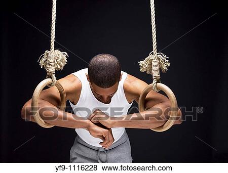 Gymnast man on Rings. View Large Photo Image Stock Photo - Gymnast man on Rings.. Fotosearch