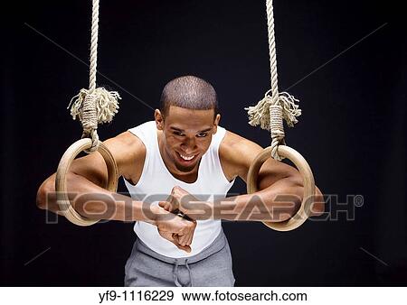 Gymnast man on Rings. View Large Photo Image Stock Photo - Gymnast man on Rings.. Fotosearch