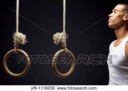 Gymnast man on Rings. View Large Photo Image Stock Photo - Gymnast man on Rings.. Fotosearch