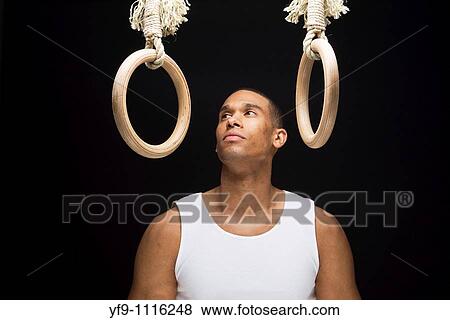 Gymnast man on Rings. View Large Photo Image Stock Photo - Gymnast man on Rings.. Fotosearch