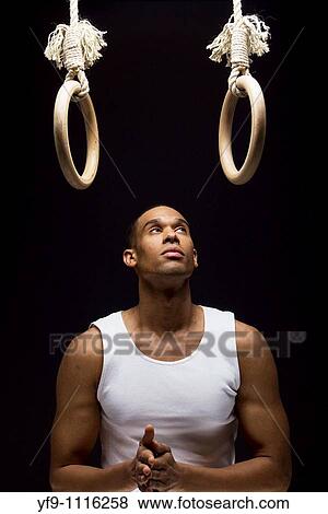 Stock Photo - Gymnast man on Rings.. Fotosearch