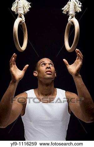 Gymnast man on Rings. View Large Photo Image Stock Photo - Gymnast man on Rings.. Fotosearch