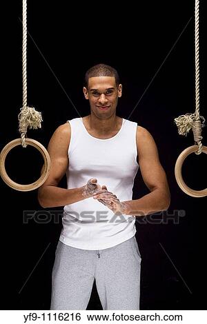 Gymnast man on Rings. View Large Photo Image Stock Photograph - Gymnast man on Rings.. Fotosearch