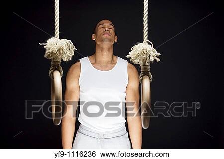 Gymnast man on Rings. View Large Photo Image Stock Photograph - Gymnast man on Rings.. Fotosearch
