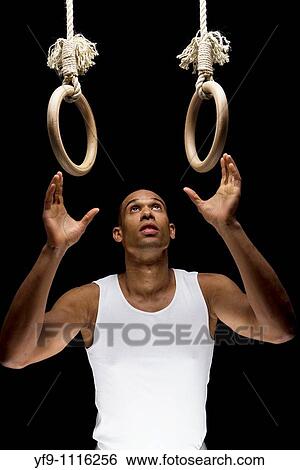 Gymnast man on Rings. View Large Photo Image Stock Photograph - Gymnast man on Rings.. Fotosearch
